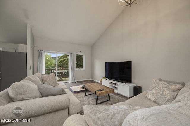 19113 Sarichef Loop, Eagle River, AK 99577 - living area with high vaulted ceiling, baseboards, and wood finished floors