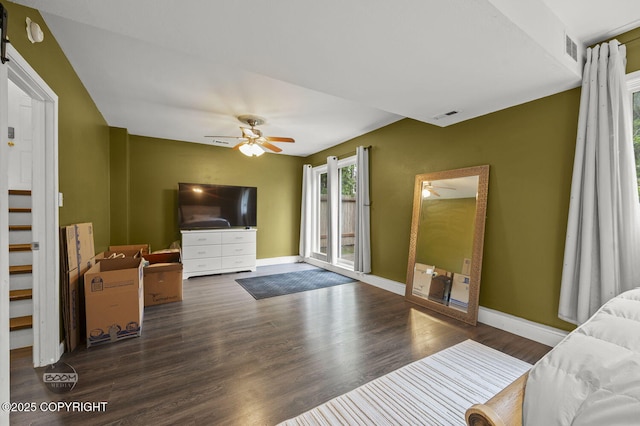 19113 Sarichef Loop, Eagle River, AK 99577 - bedroom with access to outside, wood finished floors, baseboards, and ceiling fan