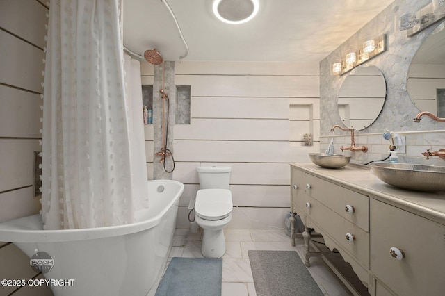 19113 Sarichef Loop, Eagle River, AK 99577 - bathroom featuring vanity, shower / bath combo with shower curtain, and toilet