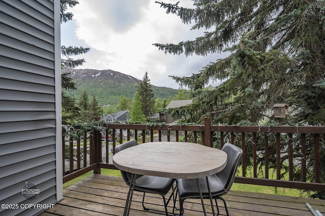 19113 Sarichef Loop, Eagle River, AK 99577 - wooden terrace with a mountain view and outdoor dining area