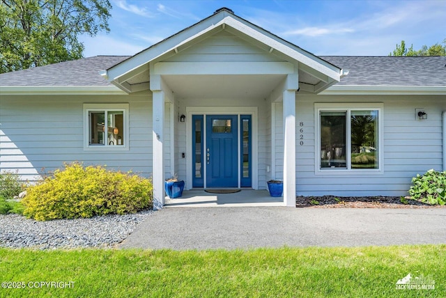 8620 Jade St, Anchorage, AK 99502 - property entrance with roof with shingles