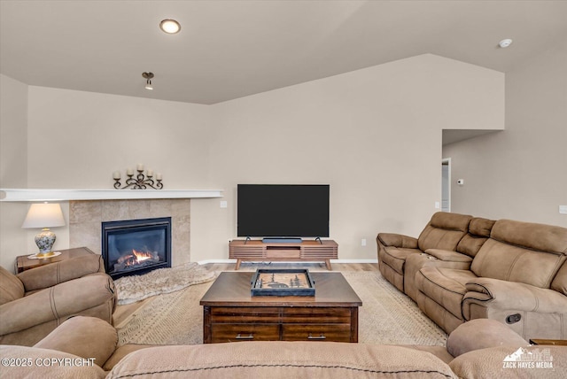 8620 Jade St, Anchorage, AK 99502 - living room with a fireplace, wood finished floors, recessed lighting, and lofted ceiling