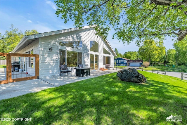 8620 Jade St, Anchorage, AK 99502 - back of house featuring a patio