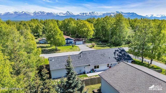 8620 Jade St, Anchorage, AK 99502 - aerial view of property and surrounding area featuring a mountainous background and a forest