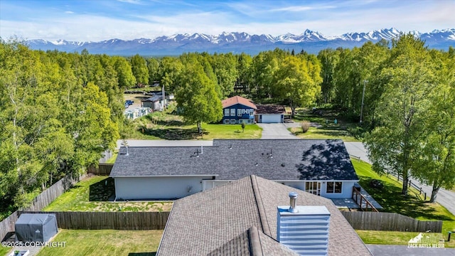 8620 Jade St, Anchorage, AK 99502 - aerial view of property and surrounding area with a mountain backdrop and a forest