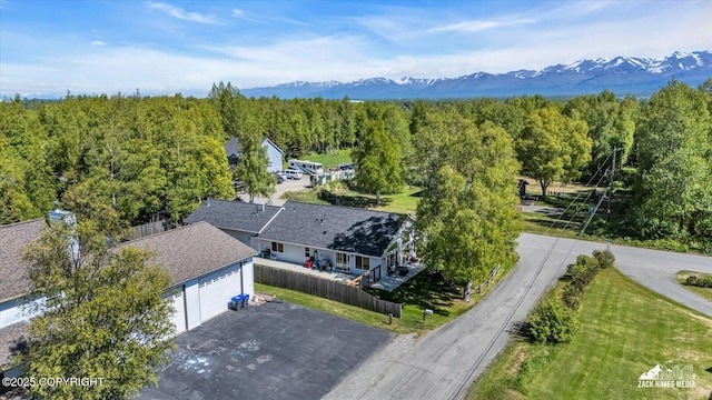 8620 Jade St, Anchorage, AK 99502 - bird's eye view of a mountain backdrop and a heavily wooded area