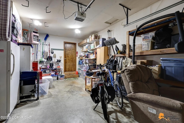 4139 Cosmos Dr, Anchorage, AK 99517 - garage with a garage door opener and freestanding refrigerator