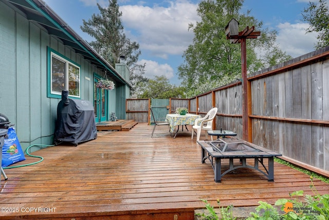 4139 Cosmos Dr, Anchorage, AK 99517 - wooden terrace with grilling area and a fenced backyard