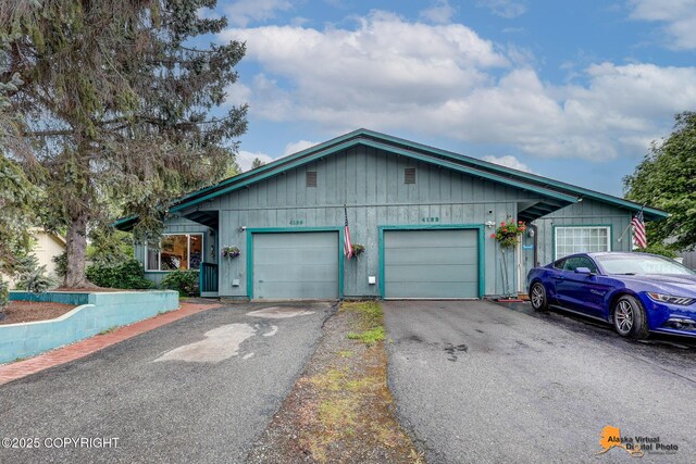 4139 Cosmos Dr, Anchorage, AK 99517 - single story home featuring an attached garage and driveway