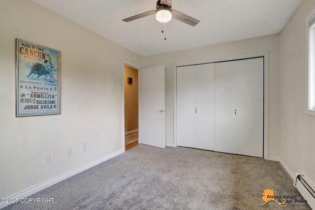 218 Deerfield Dr, Anchorage, AK 99515 - unfurnished bedroom with a baseboard radiator, carpet, baseboards, and a closet