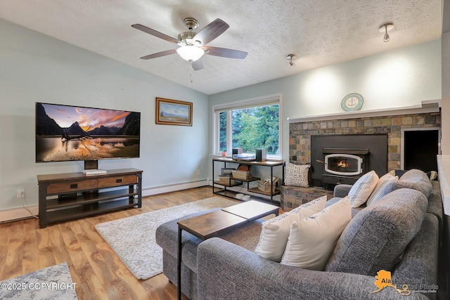 218 Deerfield Dr, Anchorage, AK 99515 - living room with baseboard heating, lofted ceiling, wood finished floors, baseboards, and a textured ceiling