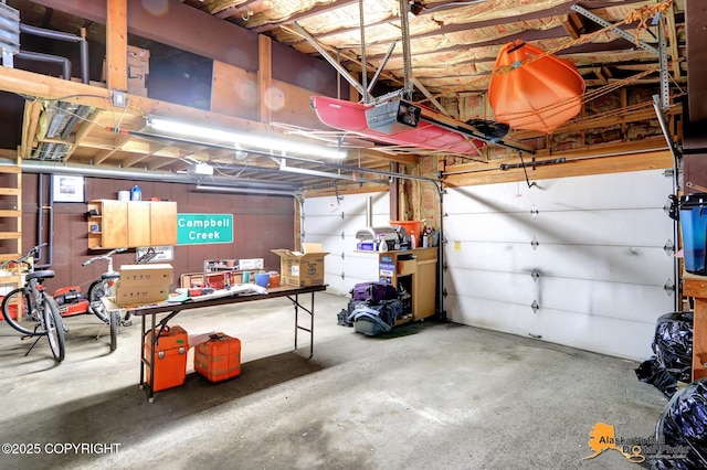 218 Deerfield Dr, Anchorage, AK 99515 - garage featuring a garage door opener