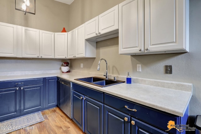 218 Deerfield Dr, Anchorage, AK 99515 - kitchen with blue cabinets, a sink, dishwasher, white cabinets, and light countertops