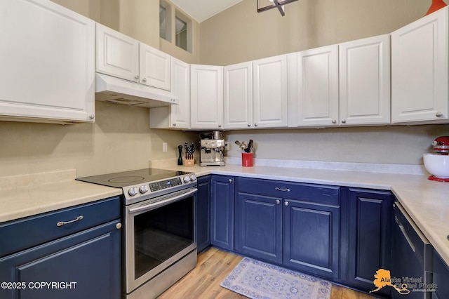 218 Deerfield Dr, Anchorage, AK 99515 - kitchen with stainless steel appliances, under cabinet range hood, blue cabinets, and white cabinets
