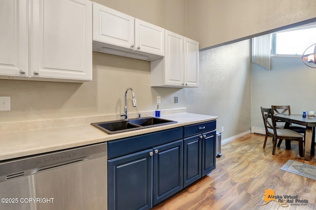 218 Deerfield Dr, Anchorage, AK 99515 - kitchen featuring dishwasher, blue cabinetry, a sink, and white cabinetry