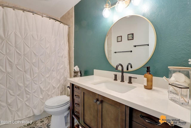 218 Deerfield Dr, Anchorage, AK 99515 - full bath featuring a textured wall, vanity, toilet, and a shower with shower curtain