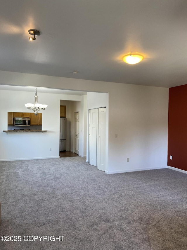 4309 Garfield St, Anchorage, AK 99503 - unfurnished living room with a chandelier and carpet floors