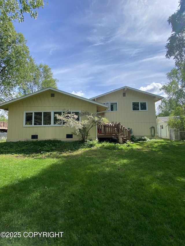 3316 Vassar Dr, Anchorage, AK 99508 - rear view of property with a wooden deck
