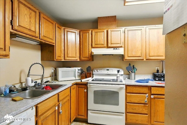 4510 Wright St # 25, Anchorage, AK 99507 - kitchen with white appliances, under cabinet range hood, light countertops, and brown cabinets