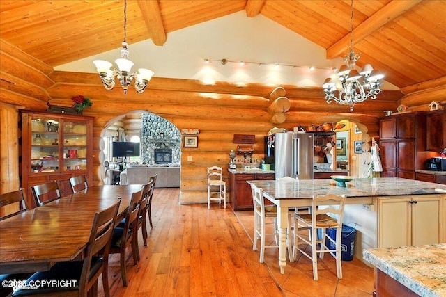 22325 Sterling Hwy, Ninilchik, AK 99639 - kitchen with arched walkways, a chandelier, wooden ceiling, light wood-type flooring, and decorative light fixtures