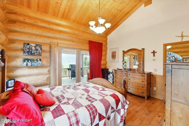22325 Sterling Hwy, Ninilchik, AK 99639 - bedroom with log walls, access to exterior, wood ceiling, wood-type flooring, and a chandelier