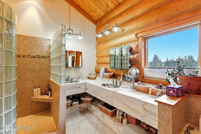 22325 Sterling Hwy, Ninilchik, AK 99639 - full bath with rustic walls, vaulted ceiling, tile patterned floors, wood ceiling, and double vanity