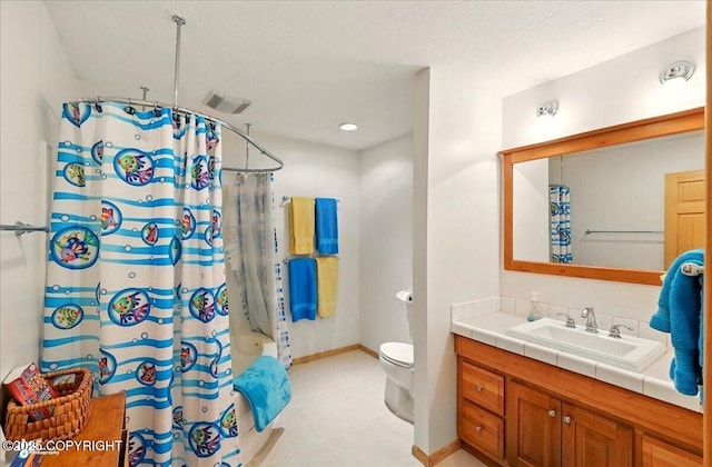 22325 Sterling Hwy, Ninilchik, AK 99639 - full bath with vanity, shower / bath combination with curtain, toilet, and baseboards