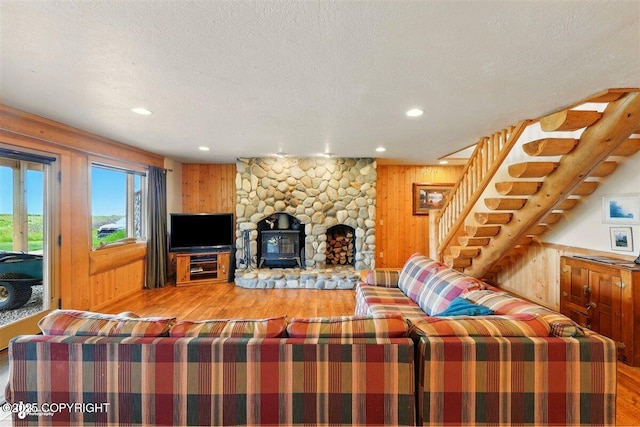22325 Sterling Hwy, Ninilchik, AK 99639 - living area featuring wood finished floors, stairway, wooden walls, recessed lighting, and a wood stove