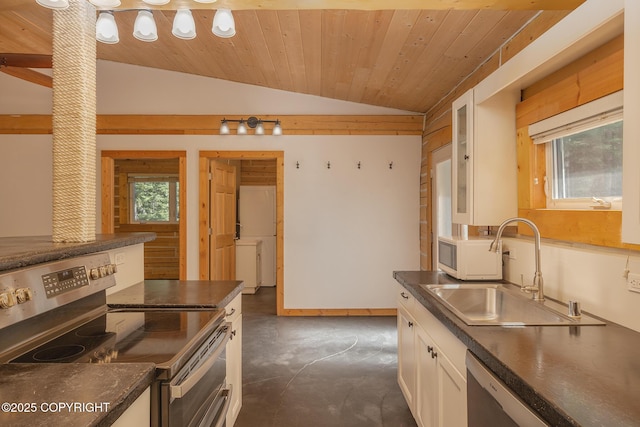 2390 Hermits Way N, Pole, AK 99705 - kitchen featuring stainless steel appliances, a sink, dark countertops, lofted ceiling, and white cabinets