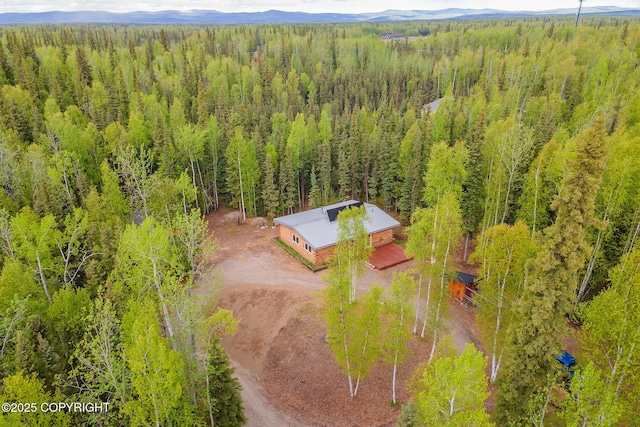 2390 Hermits Way N, Pole, AK 99705 - aerial view of property and surrounding area with a heavily wooded area and mountains