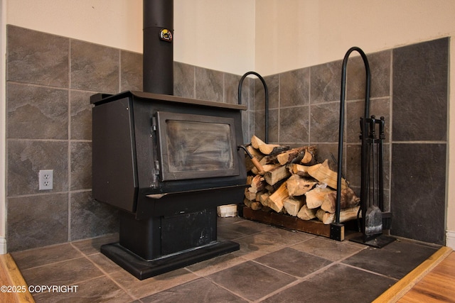 11838 N Hagion Shores Dr, Willow, AK 99688 - detailed view of a wood stove, tile walls, and wood finished floors