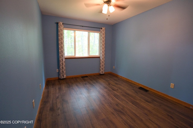 11838 N Hagion Shores Dr, Willow, AK 99688 - spare room with a ceiling fan, dark wood-style flooring, and baseboards