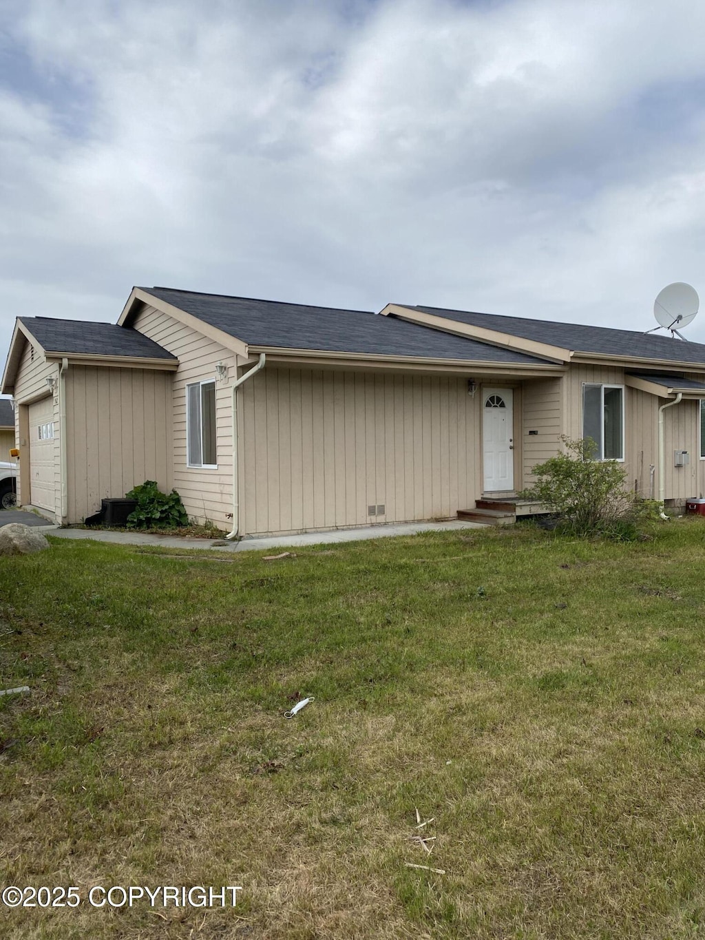 9162 Aphrodite Dr, Anchorage, AK 99515 - view of front of house with a garage and a front yard