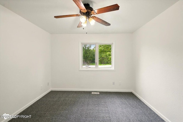 557 N Glenn Hwy, Palmer, AK 99645 - unfurnished room featuring dark carpet, baseboards, and a ceiling fan