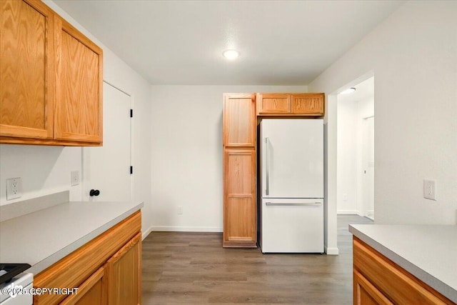 557 N Glenn Hwy, Palmer, AK 99645 - kitchen with freestanding refrigerator, wood finished floors, light countertops, baseboards, and recessed lighting