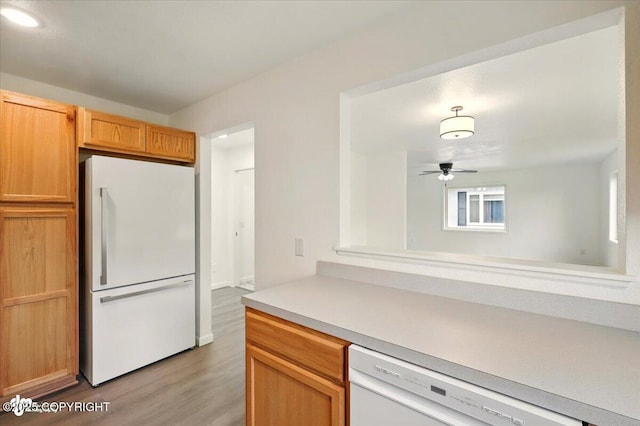 557 N Glenn Hwy, Palmer, AK 99645 - kitchen featuring white appliances, light wood-style floors, light countertops, and ceiling fan