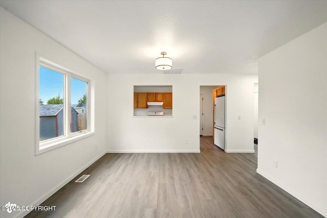 557 N Glenn Hwy, Palmer, AK 99645 - unfurnished living room with dark wood finished floors and baseboards