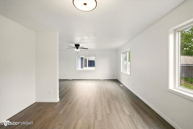 557 N Glenn Hwy, Palmer, AK 99645 - spare room featuring wood finished floors, baseboards, and a ceiling fan