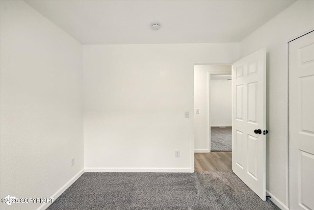 557 N Glenn Hwy, Palmer, AK 99645 - carpeted empty room featuring baseboards and a smoke detector