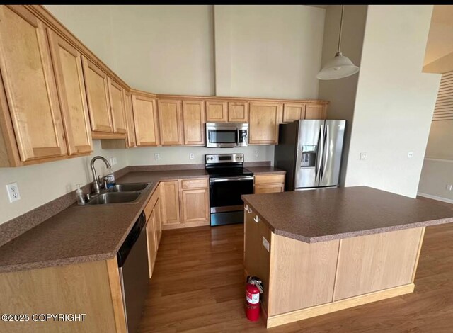 7252 Glade Pl # 4, Anchorage, AK 99518 - kitchen featuring stainless steel appliances, a high ceiling, dark wood-style floors, light brown cabinets, and dark countertops