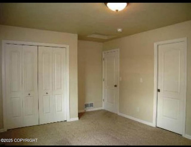 7252 Glade Pl # 4, Anchorage, AK 99518 - unfurnished bedroom with a closet and carpet flooring