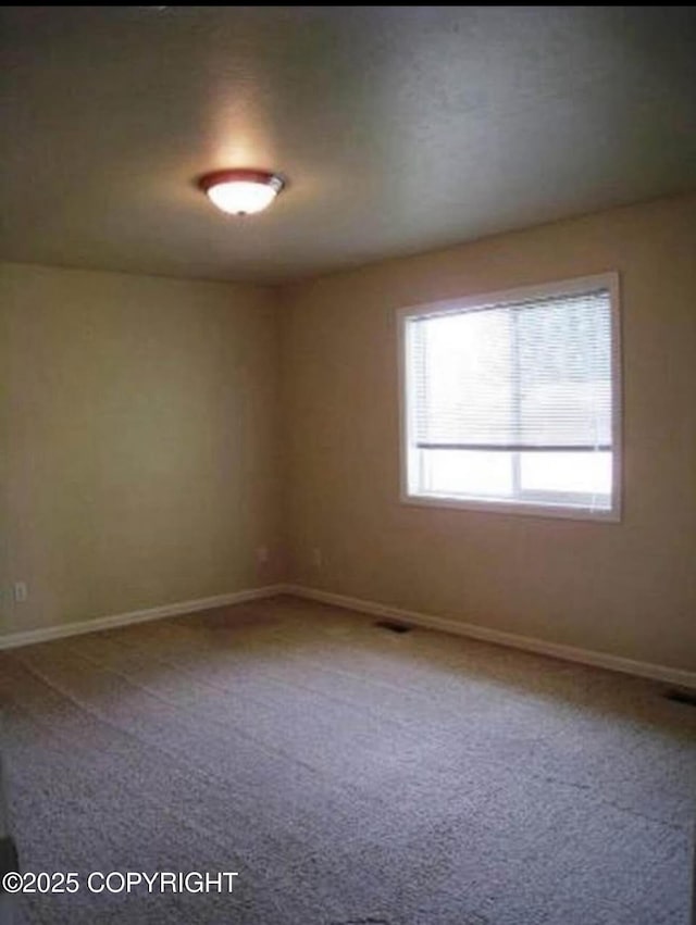 7252 Glade Pl # 4, Anchorage, AK 99518 - carpeted empty room with baseboards