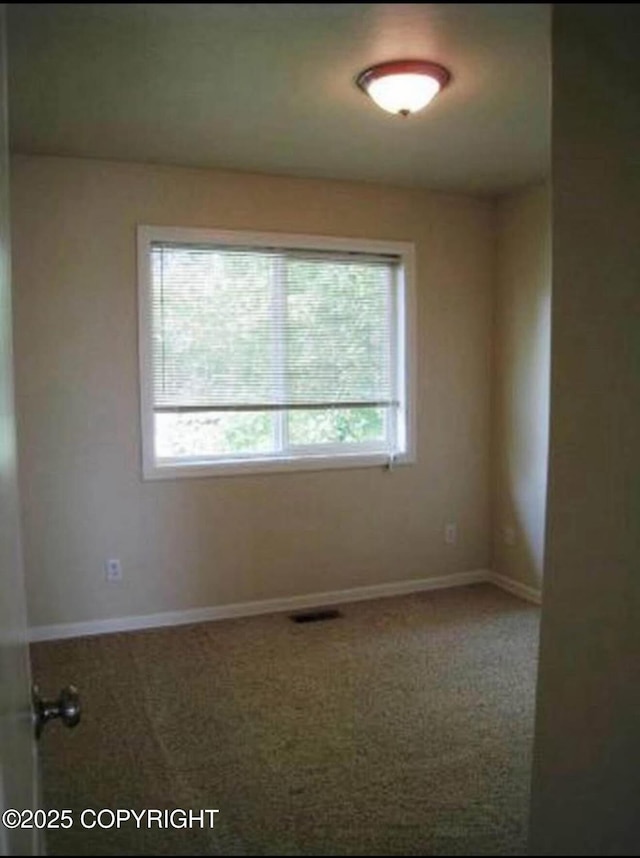 7252 Glade Pl # 4, Anchorage, AK 99518 - empty room featuring carpet flooring and baseboards