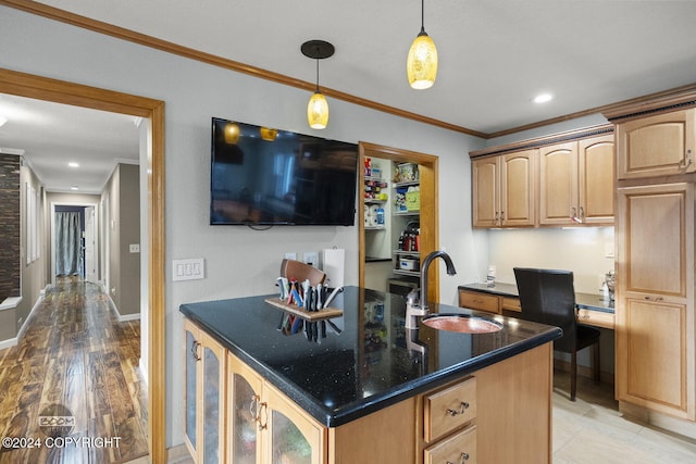 4745 Manytell Ave, Anchorage, AK 99516 - kitchen with a sink, ornamental molding, dark stone counters, pendant lighting, and glass insert cabinets