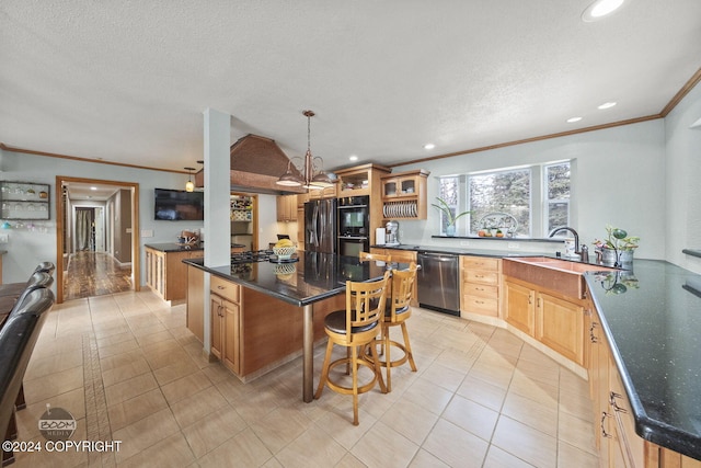 4745 Manytell Ave, Anchorage, AK 99516 - kitchen featuring appliances with stainless steel finishes, crown molding, a sink, a kitchen island, and a breakfast bar area