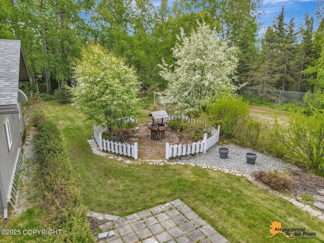 4745 Manytell Ave, Anchorage, AK 99516 - view of yard with an outdoor fire pit and a patio area