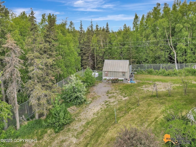 4745 Manytell Ave, Anchorage, AK 99516 - view of yard with a forest view and an outdoor structure