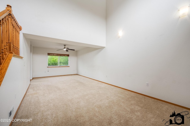 118 S Vickie Cir, Palmer, AK 99645 - spare room with light carpet, baseboards, and a ceiling fan