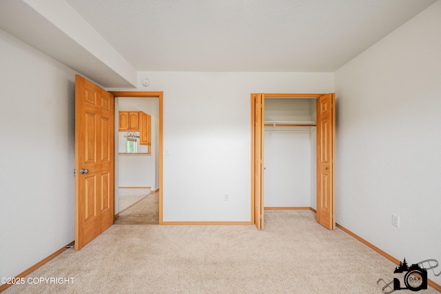 118 S Vickie Cir, Palmer, AK 99645 - unfurnished bedroom featuring light carpet, baseboards, and a closet