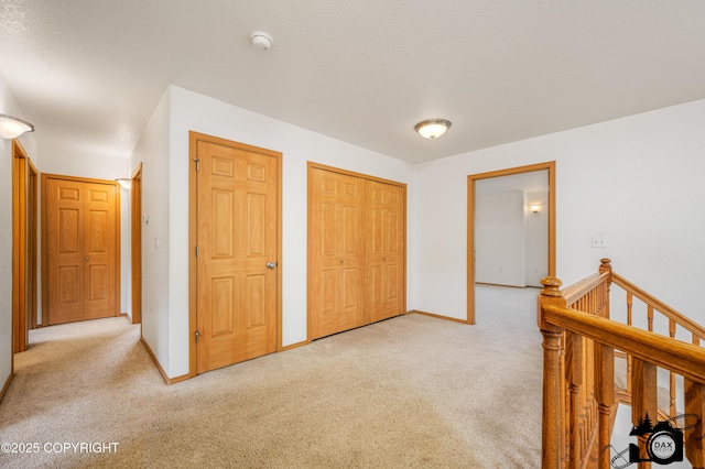 118 S Vickie Cir, Palmer, AK 99645 - corridor featuring carpet floors, baseboards, and an upstairs landing